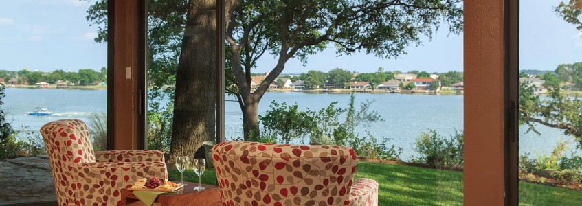 Two comfortable chairs near a large plate window