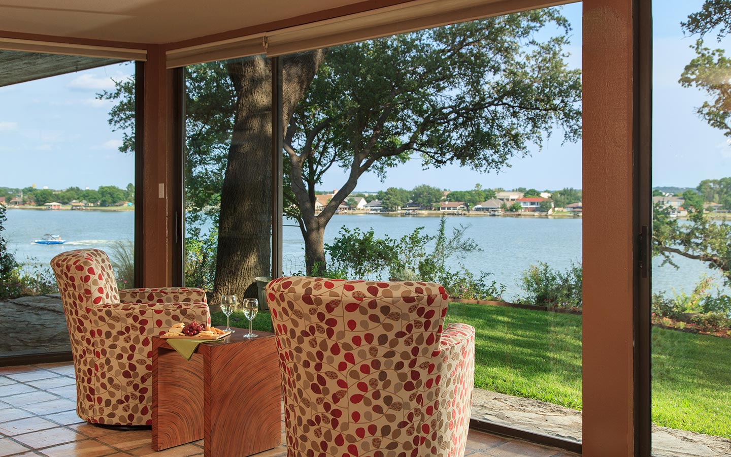 Two comfortable chairs near a large plate window