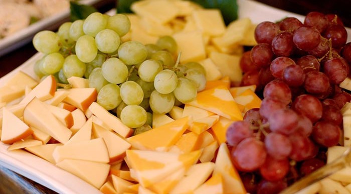 Cheese and fruit plate with grapes