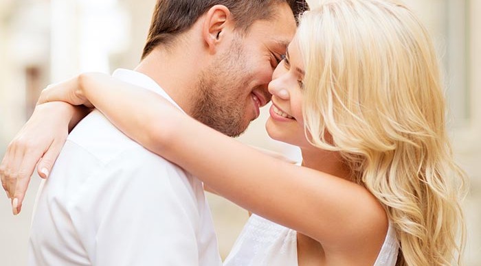 Young couple hugging and smiling