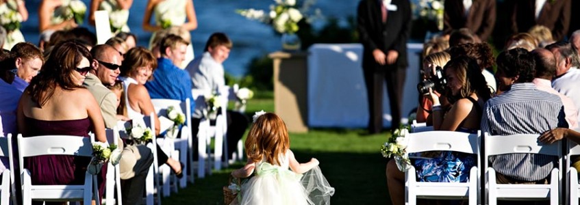 The flower girl walks the aisle