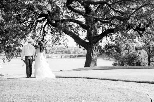 Bride and groom hold hands