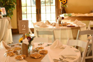 White wedding dining tables set for dinner