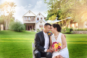 couple in chairs touching heads