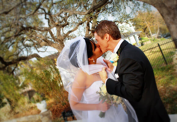 bride and groom kissing