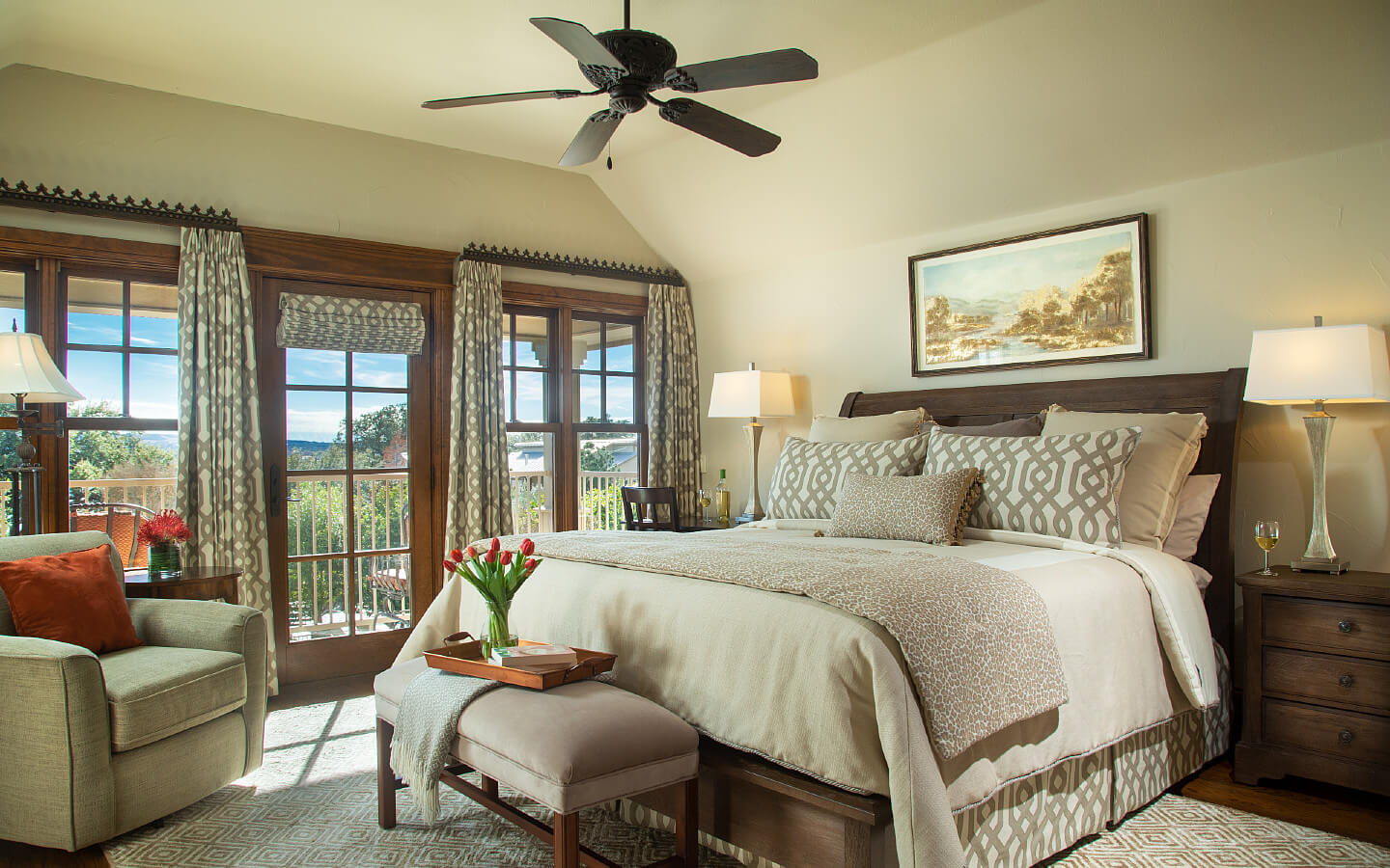 bedroom with dark wood furniture and cream colored walls and bedding