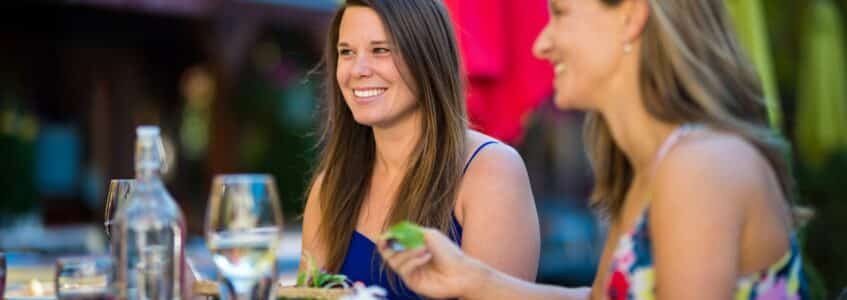 Two women dining while exploring outside dining in Granbury TX